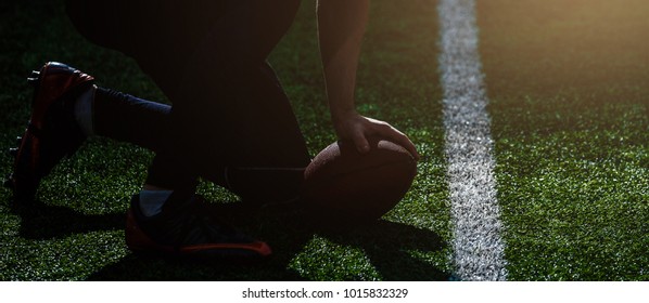 Close Up Of Football Players Linemen Lining Up And Snapping The Ball And Starting The Play