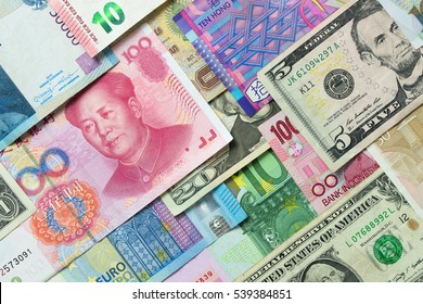 Close up of foreign currency banknotes forming background