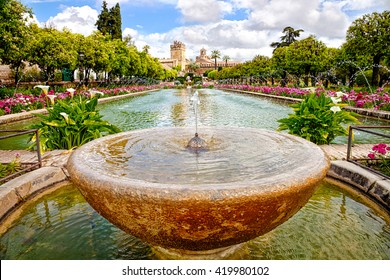 Close Up Of Fountain In The Famous Gardens Of Alcazar De Los Reyes Cristianos, A Medieval Building Located In The Andalusian City Of Cordoba, Spain, Near The Guadalquivir River And Mezquita.