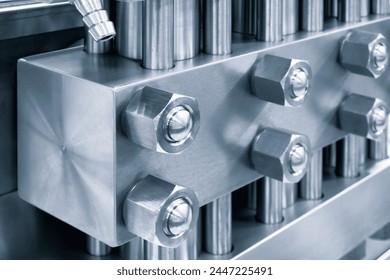 A close up of four bolts on a metal surface. The bolts are silver and have a shiny appearance. Concept of precision and attention to detail, as the bolts are clearly visible and well-defined - Powered by Shutterstock