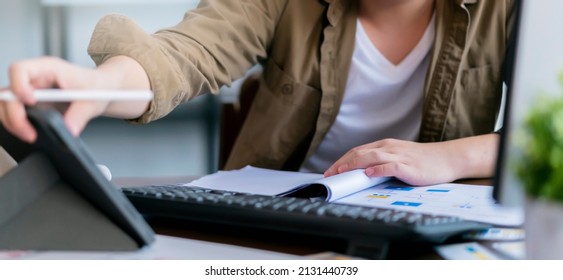 Close Up Freelance Businessman's Hand Working Hand Using Pen Write On Tablet And Pc Computer Focus Analysis Concentrate Estimate Budget With Paper Number Chart Business Ideas Concept Banner Size