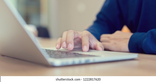close up freelancer man hand touch on pad bar laptop for searching job or fill out personal data to application form in job website and work from home concept