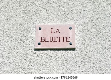 Close Up Of French House Name Plaque Translated As 'The Cornflower' 