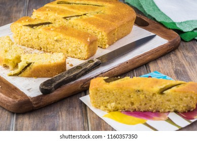 Close Up Of Fresh Baked Cut Hatch Chili Pepper Cornbread On A Cutting Board.