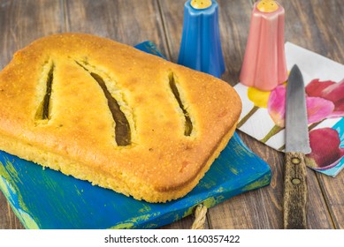 Close Up Of Fresh Baked Hatch Chili Pepper Cornbread On A Cutting Board.