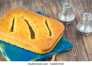 Close Up Of Fresh Baked Hatch Chili Pepper Cornbread On A Cutting Board.