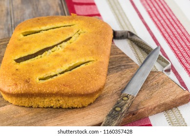 Close Up Of Fresh Baked Hatch Chili Pepper Cornbread On A Cutting Board.