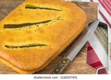 Close Up Of Fresh Baked Hatch Chili Pepper Cornbread On A Cutting Board.