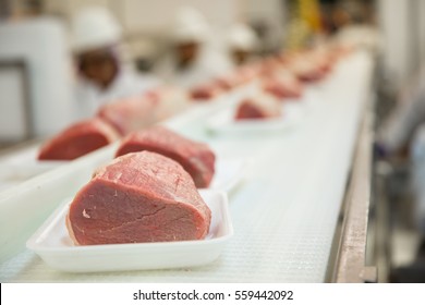 Close Up Of Fresh Cut Raw Meat At Factory Packaging Plant