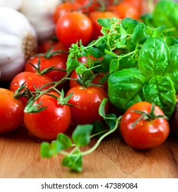 Close Up Of Fresh Herbs,tomatoes And Garlic