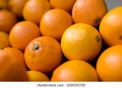 Close Up Of Fresh Juicy Large Spanish Naval Oranges On A Traditional Market Stall In England, United Kingdom