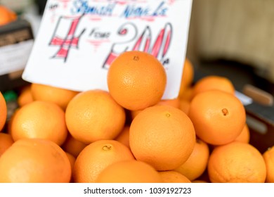 Close Up Of Fresh Juicy Large Spanish Naval Oranges On A Traditional Market Stall In England, United Kingdom