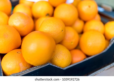 Close Up Of Fresh Juicy Large Spanish Naval Oranges On A Traditional Market Stall In England, United Kingdom