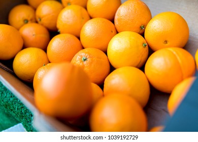 Close Up Of Fresh Juicy Large Spanish Naval Oranges On A Traditional Market Stall In England, United Kingdom