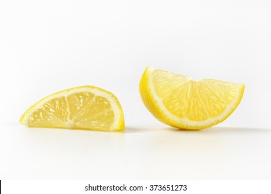 close up of fresh lemon slices on white background