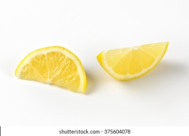 close up of fresh lemon slices on white background