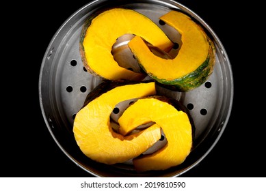 Close Up Fresh Oganic Pumpkin Slice In Steamer Pot For Homemade Cooking 