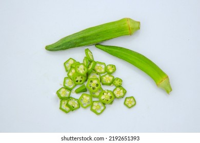 Close up of fresh okra isolated on white background. Fresh green okra vegetable isolated on white background. Okras on white background. Okra or ladyfingers vegetable on white background.