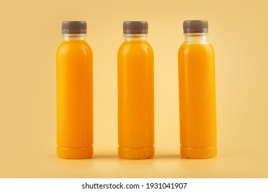 Close up of fresh orange juice in a plastic bottle with brown bottle cap. For fresh up in summer. Good beverage for health.