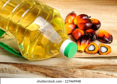 Close Up Of Fresh Palm Oil Seeds And Cooking Oil