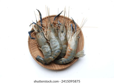 Close up a Fresh Raw shrimp,prawns,Giant Freshwater Prawn, Freshwater Prawn, Giant River Prawn (Macrobrachium rosenbergii ) For cooking seafood food in the  wooden plate isolated on white backdrop