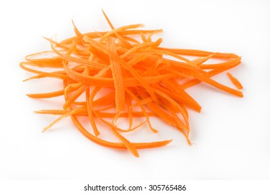 Close Up Of Fresh Shredded Carrots On A White Background.