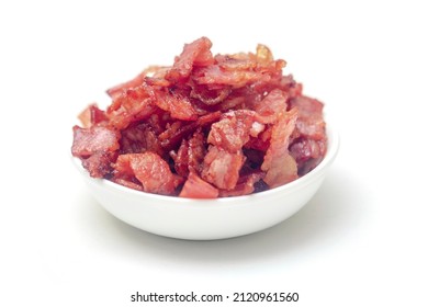 Close Up Of Fried Bacon Pieces Isolated White Background.