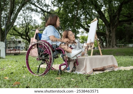 Similar – Older woman in a wheelchair