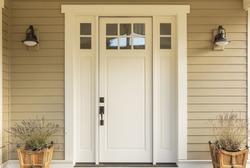 Close up of a front door with small square decorative windows and flower pots, an Architecture Photo by David Papazian