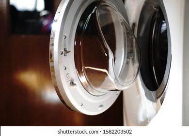 Close Up Front Load Washing Machine Door Open.