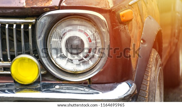 Close up to front of old classic car\
background view. Vintage of the car\
wallpaper.