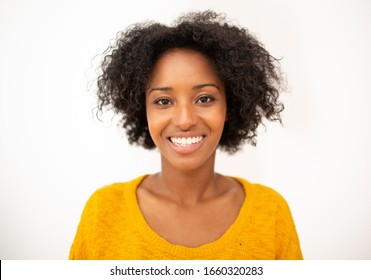 Close Up Front Portrait Smiling Young African American Woman With Curly Hair By Isolated White Background