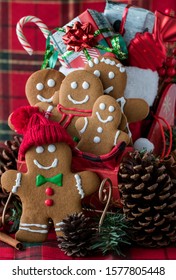 Close Up Front View Of A Gingerbread Family In A Sleigh With A Sack Full Of Christmas Gifts In The Sleigh.