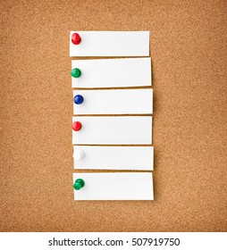 Close Up Front View Of Illustrative Corkboard With Blank White Note Cards Pinned With Colorful Pins, On Pinboard Background.