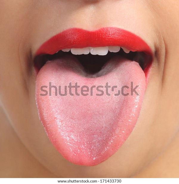 Close up of a front view of a woman tongue and red\
painted lips        