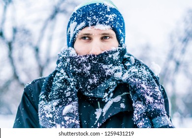 Close Up Frost Man's Face With Scarf Covered By Snow On A Winter Day