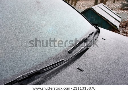 Close up of frost on the car glass and body in winter. Volkswagen logo. Poland, Europe                  