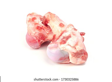 Close Up Frozen Fresh Pork Bones With Red Meat Stuck To Be Used For Making Pork Bone Broth On A White Background