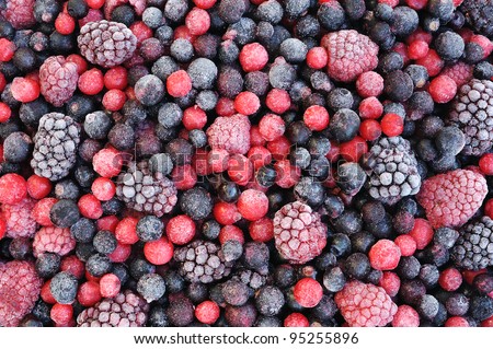 Close up of frozen mixed fruit  - berries - red currant, cranberry, raspberry, blackberry, bilberry, blueberry, black currant