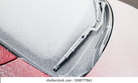 Close Up Of Frozen Windshield And Car Wiper In Winter