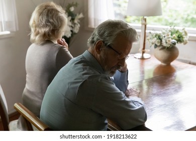 Close up frustrated offended mature man and woman ignoring each other after quarrel, sitting back to back, not talking, upset elderly man thinking about relationship problems, family crisis conflict - Powered by Shutterstock