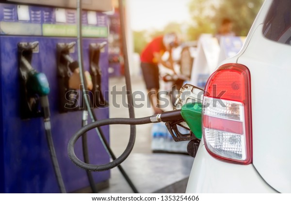 Close up of fuel monitoring system refueling\
a petroleum to vehicle at gas\
station.