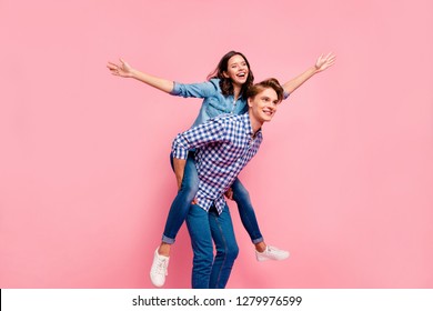 Close Up Full Length Body Size Photo Of Piggy Back Hug She Her He Him His Lady Guy Hands Apart Look To Empty Space Ready To Off Land Wear Casual Jeans Denim Plaid Shirts Isolated On Rose Background