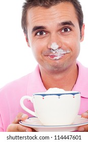 Close Up Of Funny Man Holding Cup Of Coffee With Whipped Cream On His Face.