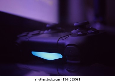 close up of gaming controller in loe light