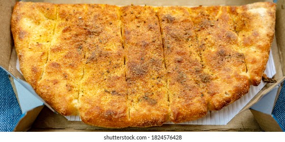 Close Up Of Garlic Bread In A Takeaway Box