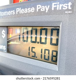 Close Up Of A Gasoline Pump Showing One Hundred Dollars For Fifteen Gallons. Grey Pump With A Screen Showing Total Cost For Gas. High Gas Prices. 