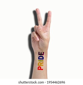 Close Up Of Gay Guy's Hand With A Tattoo That Says Pride And Nail Polish. Symbol Of Sexual Liberation And Tolerance