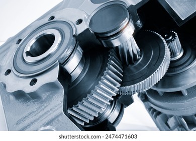 A close up of a gear with a black and white filter. Concept of precision and complexity, as gears are intricate and interlocking components of machinery. The black and white filter adds a timeless