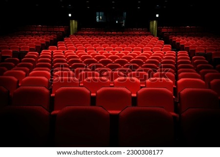 Close up of generic red theater seats with balcony